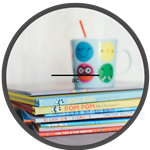 stack of books with a mug on top